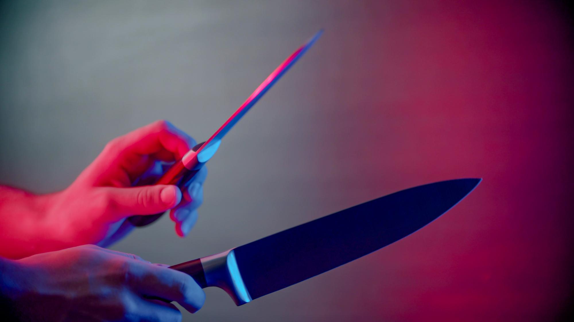 Assistant instructor demonstrating knife skills